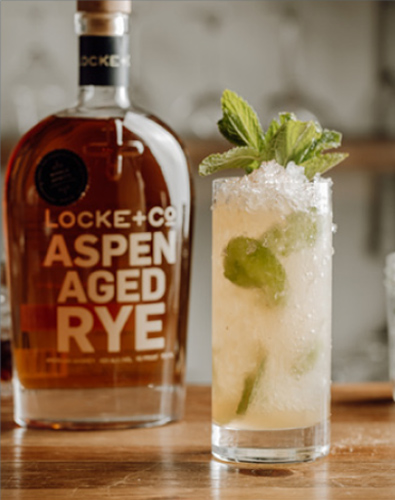 Locke + Co-Aspen Aged Rye Whiskey Bottle with an Aspen Swizzle Cocktail