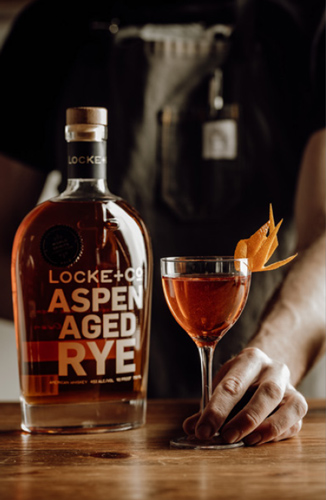 A-frame Cocktail and a Locke + Co Rye Whiskey Bottle